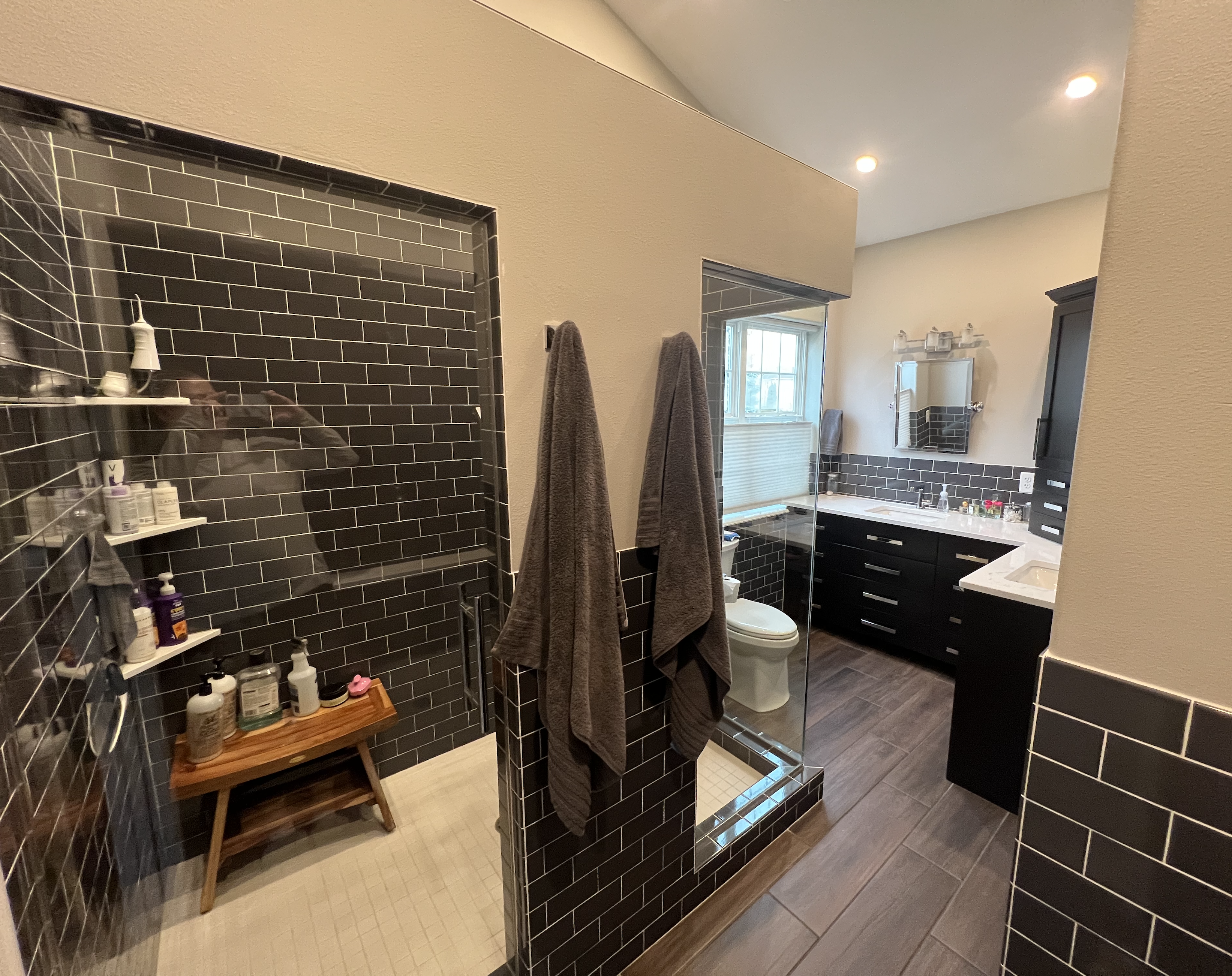residential bathroom with shower & sinks photo