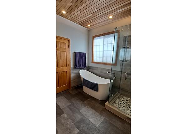 shower, tub, wood ceiling & window photo